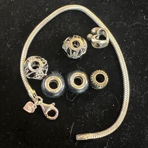 925 STERLING SILVER ITALY BRACELET WITH 6 STERLING CHARMS.